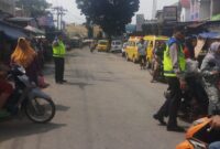 Antisipasi Gangguan Keamanan, Personil Polsek Salapian melaksanakan Patroli di Pasar Tradisional