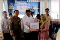 HUT Desa Muntialo, Bupati Serahkan Bantuan Pada Warga Korban Banjir