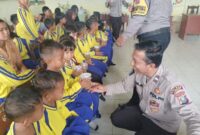 Dukung Program Pemerintah, Kapolsek Hinai Berikan Bubur Kacang Hijau Gratis kepada Pelajar SD Negeri 057213 Cempa