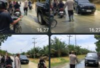 Personel Polsek Padang Tualang, Polres Langkat, Polda Sumatera Utara, bergerak cepat melakukan pengaturan lalu lintas di tengah kondisi banjir