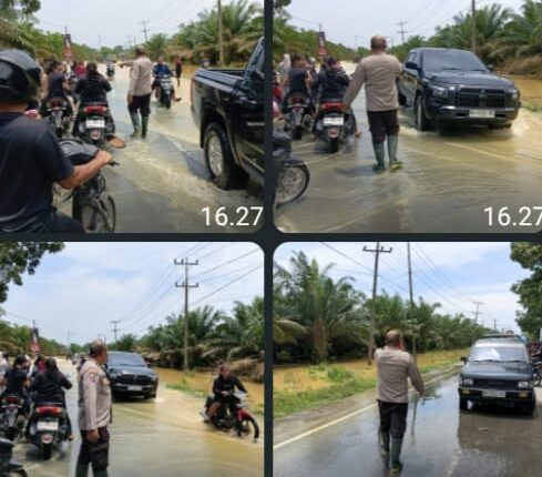 Banjir Rendam Jalan Sumor bor-Tanjung Selamat, Polsek Padang Tualang Sigap Atur Lalu Lintas
