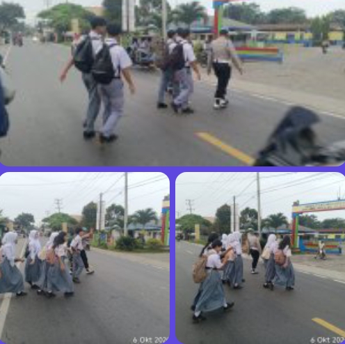 Pengaturan Lalu-lintas pagi hari memberikan pelayanan kepada anak-anak Sekolah dan masyarakat Pengguna Jalan.